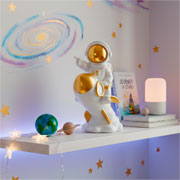 Escultura em resina astronauta no foguete branco e dourado I 18x10 cm 